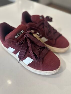 adidas' Maroon Suede Sneaker with White Stripes